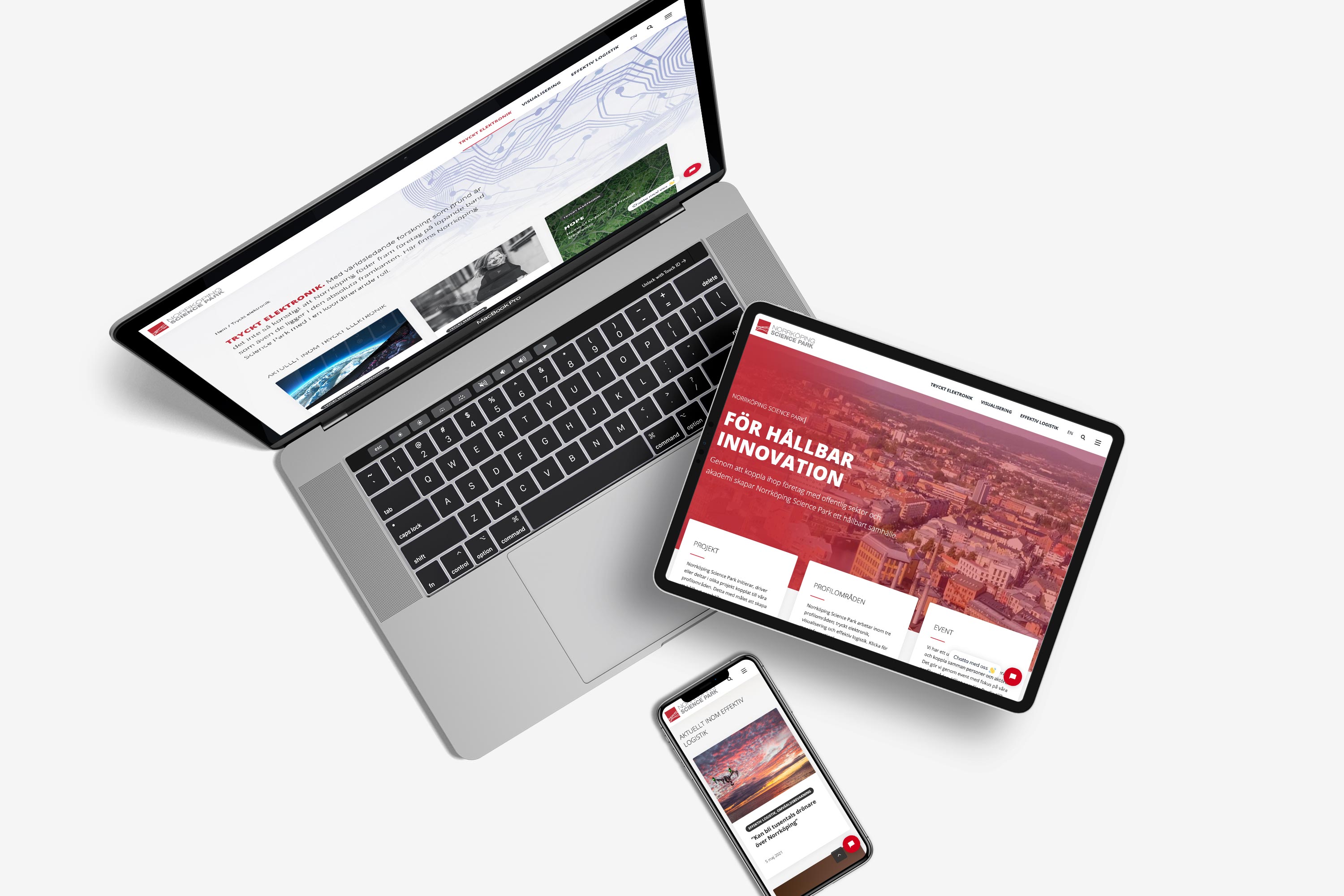 En laptop, en surfplatta och en mobil som visar Norrköping Science Parks hemsida som utvecklades av Bishop Media